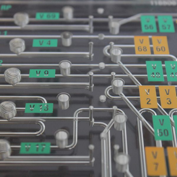 Microfluidic Channels in a Diffusion Bonded Plastic Manifold Used in Immunoassay Instruments